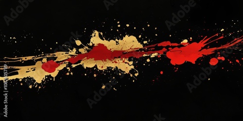 Abstract gold and red paint splatter on dark background