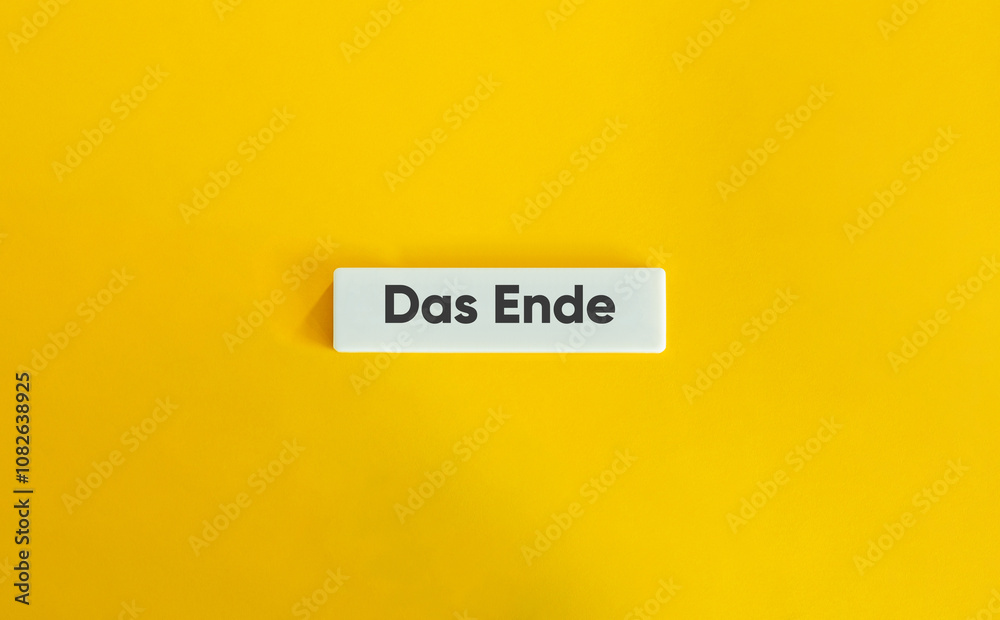 The End Word. Text on Block Letter Tile on Yellow Background. Minimal Aesthetic. The End Word. Text on Block Letter Tile on Yellow Background. Minimal Aesthetic.