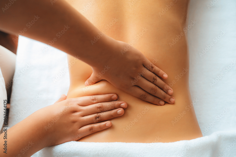 Closeup woman customer enjoying relaxing anti-stress spa massage and pampering with beauty skin recreation leisure in day light ambient salon spa at luxury resort or hotel. Quiescent Closeup woman customer enjoying relaxing anti-stress spa massage and pampering with beauty skin recreation leisure in day light ambient salon spa at luxury resort or hotel. Quiescent