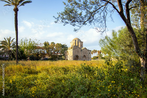 Panoramic view of historical  Byzantine period Hagia Zoni church  with flowers Famagusta, Cyprus photo