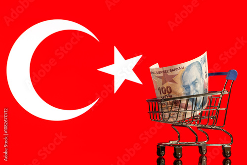 100 Turkish lira banknote against the background of the Turkish flag photo