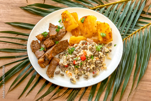 Traditional rustic tropical Brazilian dish, sun-dried beef with green beans, cassava, biquinho pepper. Creative rustic photography photo