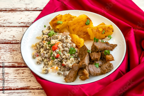 Traditional rustic tropical Brazilian dish, sun-dried beef with green beans, cassava, biquinho pepper. Creative rustic photography photo