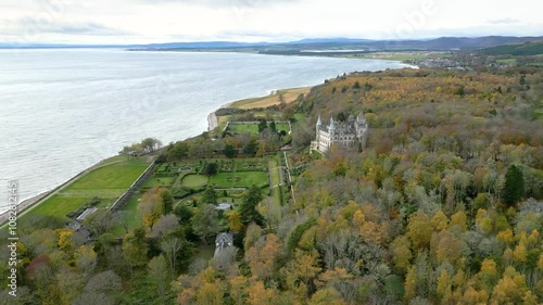 dunrobin castle gardens looking over sea scotland luxury resort estate associated dukes beautifully framed by autumn landscape aerial drone shot view footage uk mansion  photo