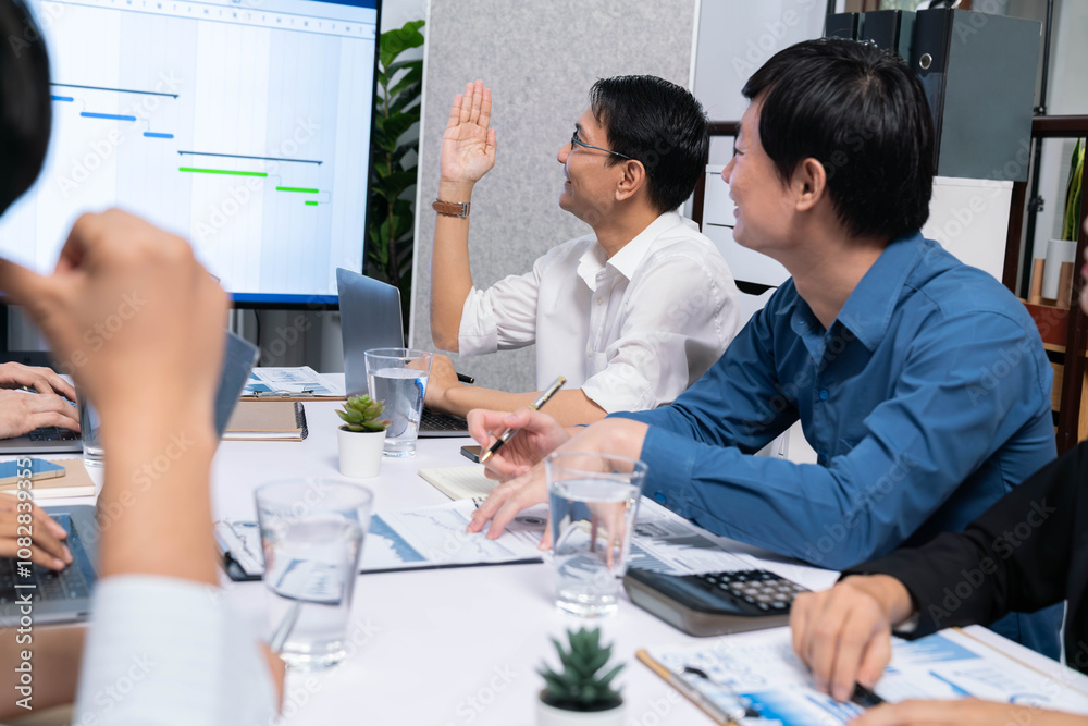 Project manager communicate and collaborate with team using project management software display on monitor, tracking progress of project task and making schedule plan at meeting table. Prudent Project manager communicate and collaborate with team using project management software display on monitor, tracking progress of project task and making schedule plan at meeting table. Prudent