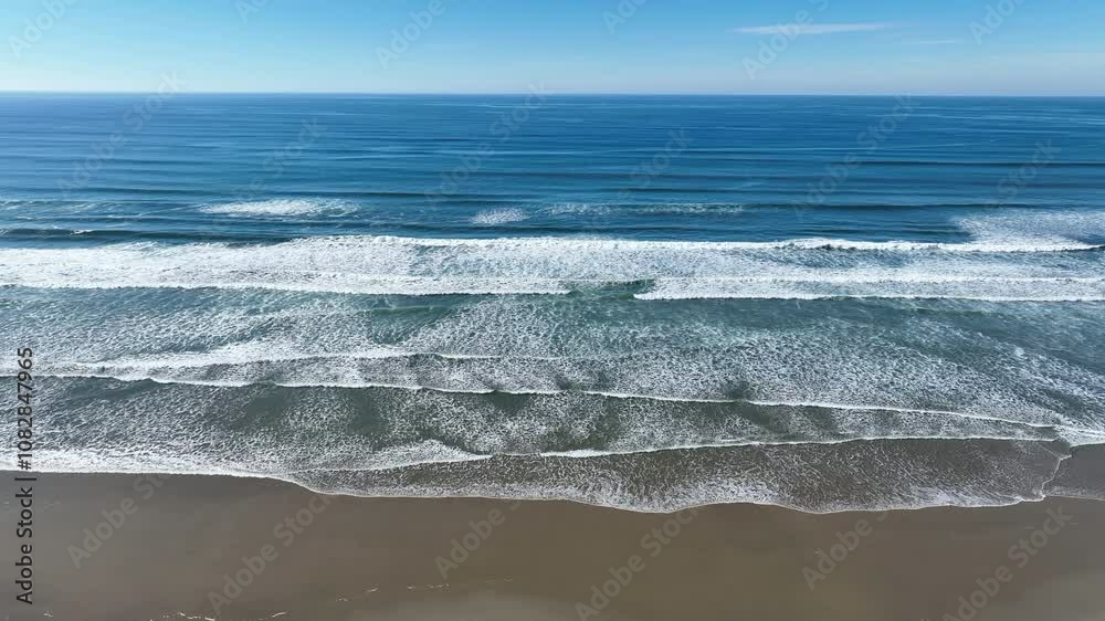 The Pacific Ocean washes against the beautiful sandy Agate beach not far south of Lincoln City, Oregon. This part of the Pacific Northwest coast is incredibly scenic and accessed from highway 101. The Pacific Ocean washes against the beautiful sandy Agate beach not far south of Lincoln City, Oregon. This part of the Pacific Northwest coast is incredibly scenic and accessed from highway 101.