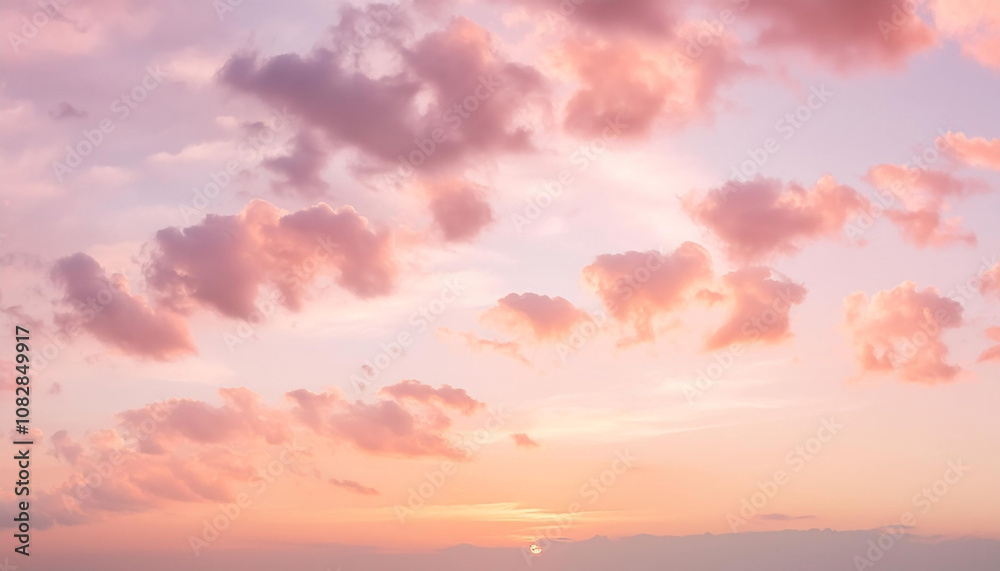 Fototapeta premium Vivid Sunset Sky with Soft Pastel Clouds in a Tranquil Atmosphere