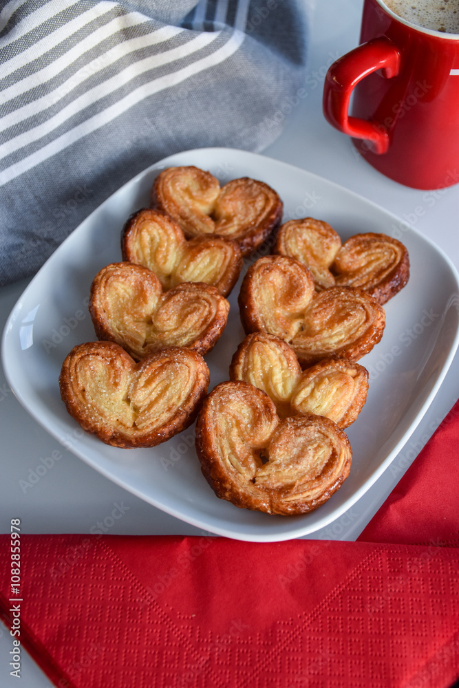 puff pastry in the shape of a heart or palm. dessert with chocolate puff pastry in the shape of a heart or palm. dessert with chocolate