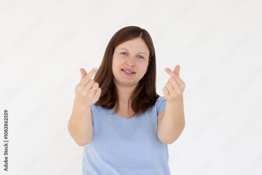 Young caucasian woman showing mini heart sign isolated on white background, Spreading love and happiness concept Young caucasian woman showing mini heart sign isolated on white background, Spreading love and happiness concept