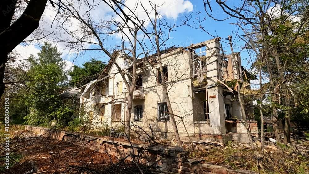 View to destroyed residential building at Donbass. Ruined house after bomb attacks on ukrainian territory from russia army. Consequences of russian invasion of Ukraine. Slow motion View to destroyed residential building at Donbass. Ruined house after bomb attacks on ukrainian territory from russia army. Consequences of russian invasion of Ukraine. Slow motion