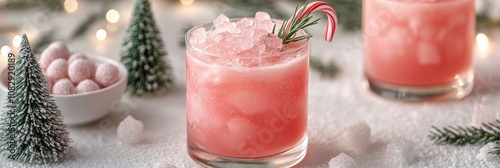 Refreshing holiday cocktail with peppermint and rosemary garnishes amidst fes...