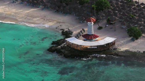 Aerial view of Bayahibe beach and close up of lighthouse.Crystal clear sea with beautiful beach.Dominican Republic.