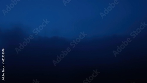 Dark gradient background with deep blue-purple hues and subtle texture resembling a misty evening sky, modernabstractart, technology, gradientbackground photo