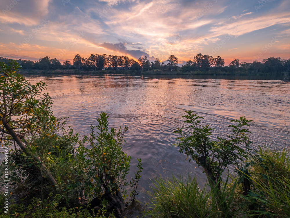Obraz premium Sunset Over The River