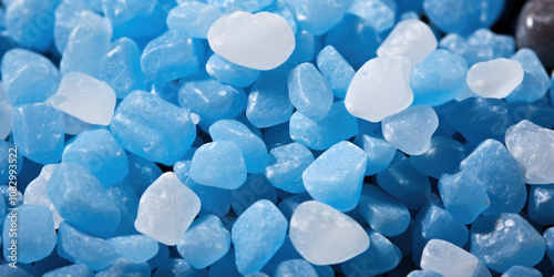 Close-up of assorted smooth blue gemstones arranged together, highlighting their diverse textures and colors