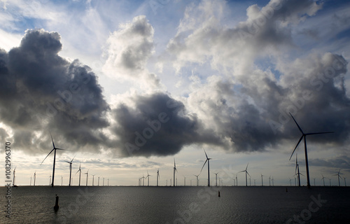 View of an offshore windpark and a beautiful cloudscape photo