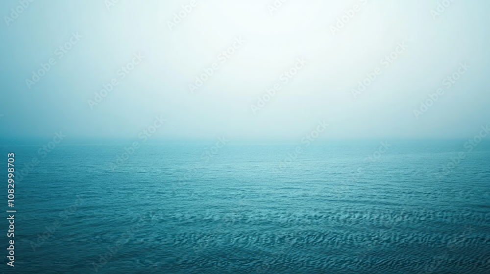 Fototapeta premium Tranquil Seascape with Soft Fog and Gentle Waves, Serene Ocean Horizon Evoking Calmness and Peacefulness in Blue and Aqua Tones for Wellness and Relaxation