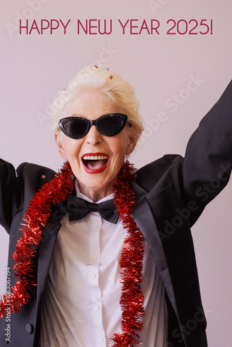 Beautiful stylish mature senior woman in sunglasses and tuxedo celebrating new year. Fun, party, style, celebration concept