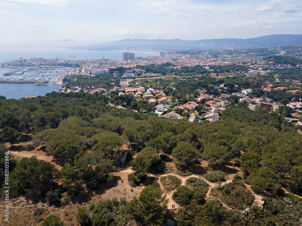 Fototapeta premium Aerial cityscape view of beach and Mediterranean Sea along Costa Brava in Palamos Catalonia