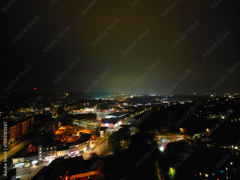 Obraz premium High Angle View of Illuminated Luton City and Downtown Homes During Dark Night. High Angle Footage Was Captured From Medium High Altitude with Drone's Camera on November 9th, 2024, England UK.