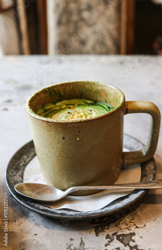 Wallpaper Mural A cup of Matcha (Japanese green tea) Latte on a table inside a cafe Torontodigital.ca