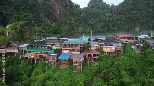 Tribal village and homestay on the cliff with mountains background in northern of Thailand