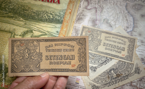 Front view of a half rupiah banknote from the Japanese colonial era. photo