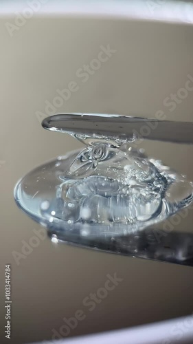 Footage video skincare liquid transparent texture drips from tube, shoot details microlens photo