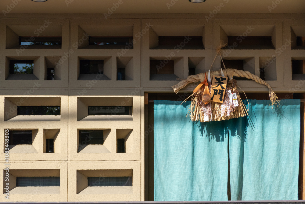 Japanese culture fetish hanging in front of building
