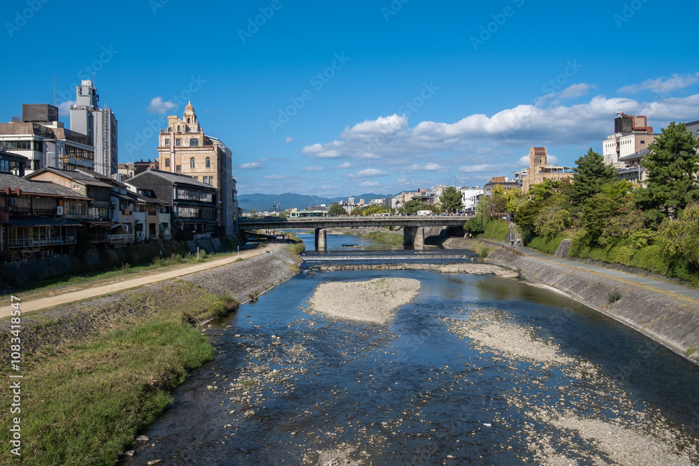 Kamo River, Kyoto, Japan The riverbanks are popular walking spots for resident and tourist. It's walkways running alongside the river, and some stepping stones that cross the river