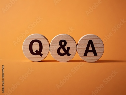 Obraz na płótnie Concept text 'Q and A' on wooden circles on a beautiful orange background. Business concept. Copy space w salonie
