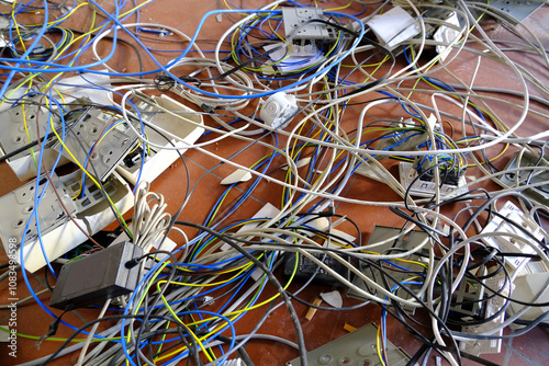 Electrical waste. Demolition of electrical equipment.Old electrical systems, cables and sockets destroyed and demolished on a construction site. Italy