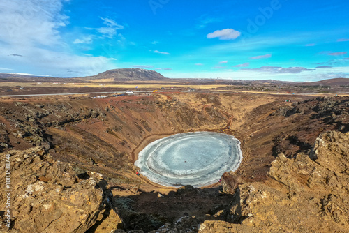 Kerid crater, huge quiet volcanic crater, in winter season become hard ice lake, in Iceland along golden circle road trip photo