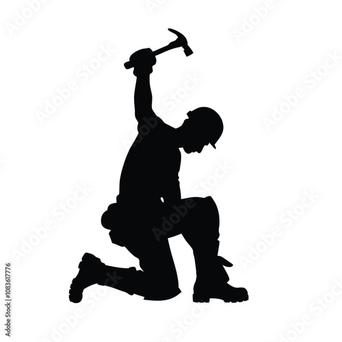 A man in a black outfit is holding a hammer and a black and white silhouette of him. He is kneeling down and he is working on something