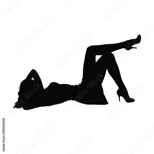 A woman is laying on her back with her legs spread apart. She is wearing a dress and high heels