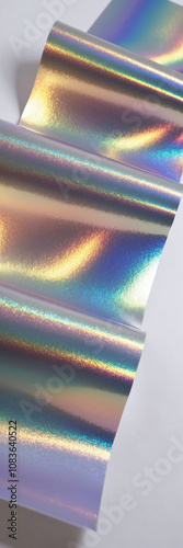 Holographic paper with a shimmering rainbow effect catching the light