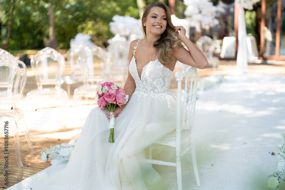 Naklejka premium The bride sits on the white chair