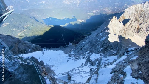 Cable car moving down the Zugspitze towards Eibsee.