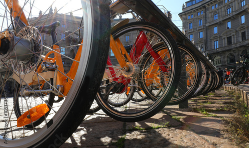 wheels of rental bikes for an eco friendly city tour without a car photo