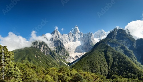 The Stunning Jade Dragon Snow Mountain in South China, Where Snow-Capped Peaks Tower Over the Verdant Valleys Below, Offering a Contrasting Landscape of Ice, Greenery, and Clear Blue Skies photo