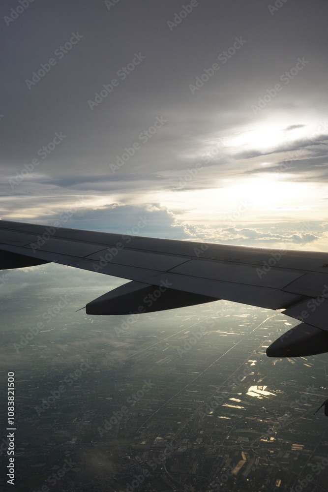 Obraz premium Airplane wing and clouds, taken on an airplane photo