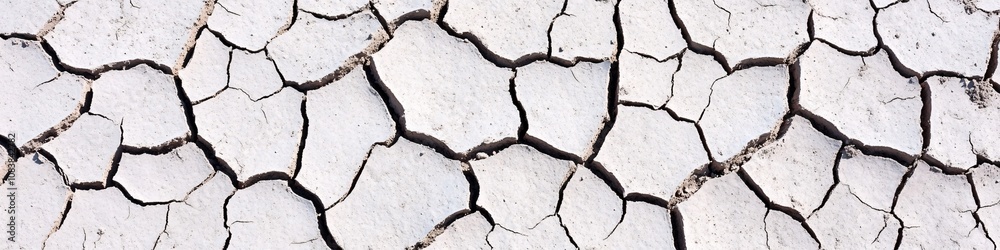 Fototapeta premium Surface of cracked dry earth highlighting drought, Concept illustration of global climate issues, global warming, climate change, drought, resource scarcity 