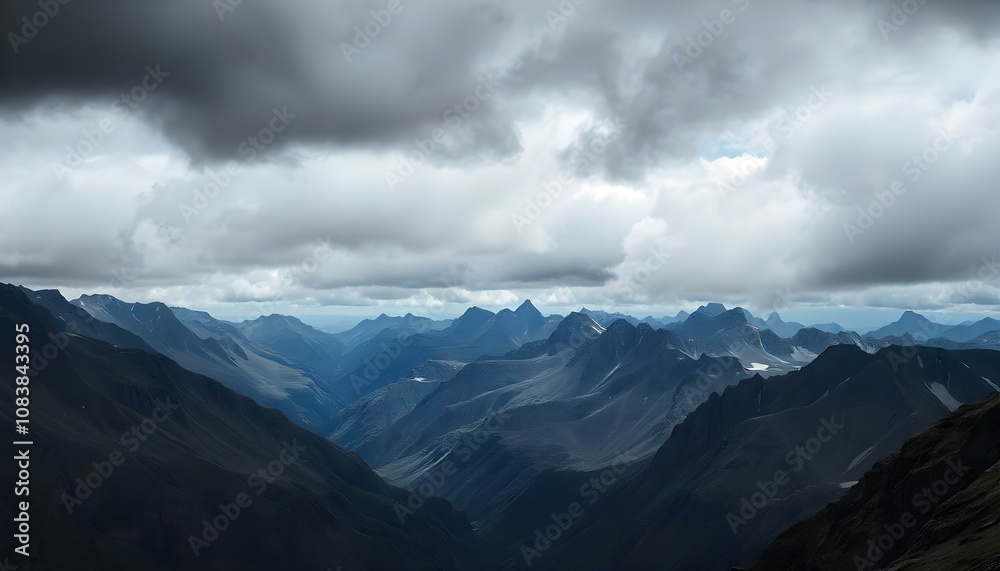 Obraz premium Storm clouds swirling above a rocky mountain range with copy space