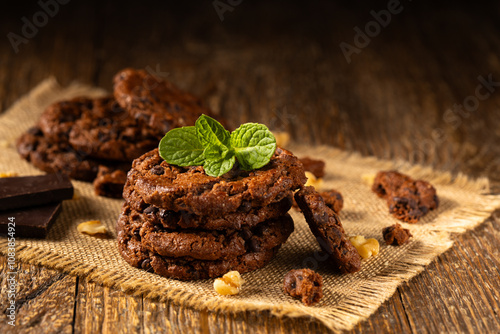 Delicious, shortcrust chocolate cookies with chocolate pieces. photo