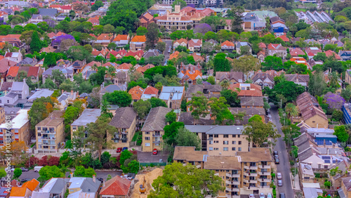 Aerial drone view over Sydney inner suburb of Glebe and Annandale close to Sydney Harbour NSW Australia beautiful colourful roof and tree lined streets green orange purple photo