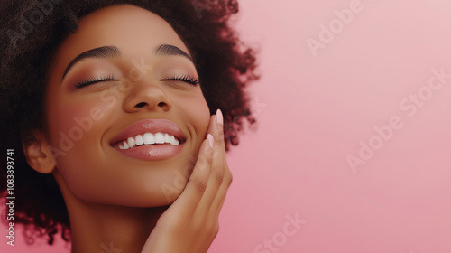 Smiling young woman touching her radiant, flawless skin with a gentle smile, featuring clear and healthy complexion. Perfect for skincare, beauty, and cosmetics concepts with copy space for advertisem photo