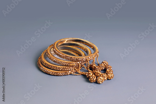 Beautiful Indian traditional gold wedding bangles	with gem stones