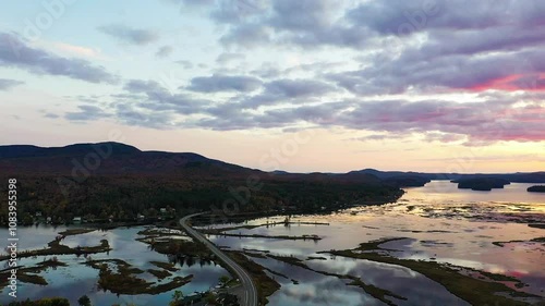 Tupper Lake in Adirondack, NY State, Moody Section, Spectacular Sunset in Fall aerial drone Rt 30 SW to West