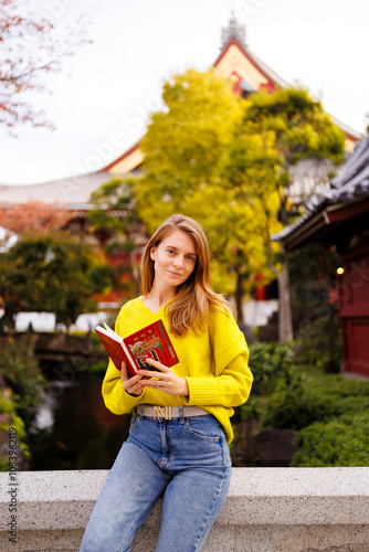 Beautiful woman tourist holding a Goshuin book