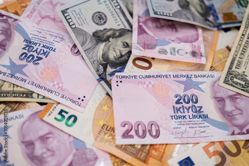 Various international currency notes including Turkish lira, US dollars, and Euros. Concept of global financial systems and currency exchange.  photo